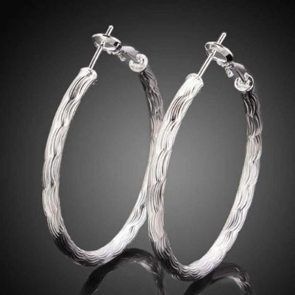 Diamond Cut Hoop Earrings In White Gold