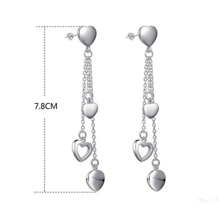 Long Dangling Heart Earrings in White Gold