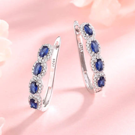 Sapphire Halo Simulated Huggie Earrings in Sterling Silver
